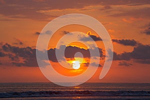 Sunset on the beach of Matapalo in Costa Rica photo