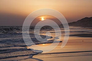 Sunset on the beach in Mazagon, Huelva photo