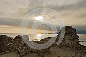 Sunset on a beach at Nora archeological site, near city of Pula, island of Sardinia