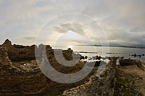 Sunset on a beach at Nora archeological site, near city of Pula, island of Sardinia