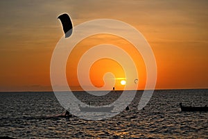 Sunset on beach reddish sky and sports man