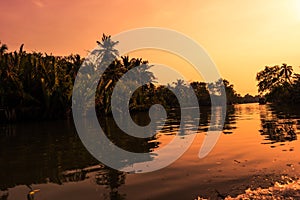 Sunset at a beach resort in the tropics.