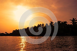 Sunset at a beach resort in the tropics.