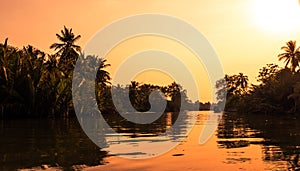 Sunset at a beach resort in the tropics.