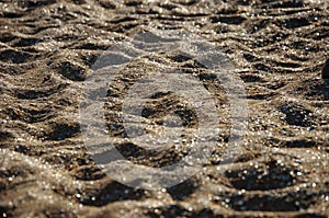Sunset on the beach. Sand texture.