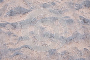 Sunset on the beach. Sand texture sea coast