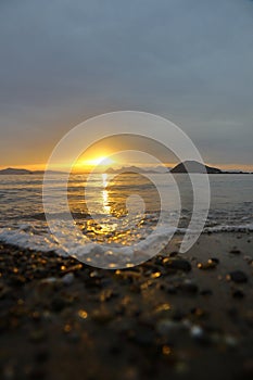 sunset on the beach. Seaside town of Turgutreis and spectacular sunsets. Selective Focus.