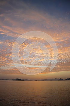 sunset on the beach. Seaside town of Turgutreis and spectacular sunsets. Selective Focus.