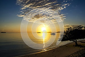 Sunset on the beach at Seraya island, Flores, Indonesia