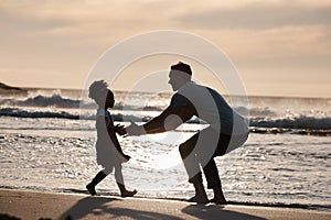 Sunset, beach and silhouette of father with girl child in nature, bond and playing, freedom and enjoying summer vacation