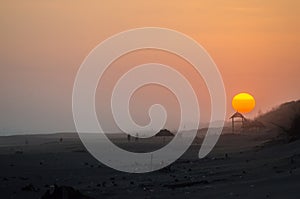 sunset beach silhouette sun trailing