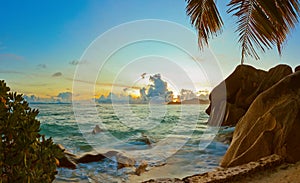 Sunset on beach Source D`Argent at Seychelles