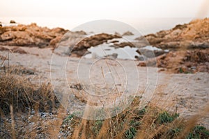 sunset at a beach on the stony east coast of Sardinia in Italy