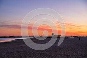 Sunset beach view of the historical life-guard building in Fuseta, Ria Formosa Natural park, Portugal