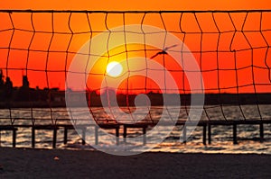 Sunset at the beach with the volleyball net