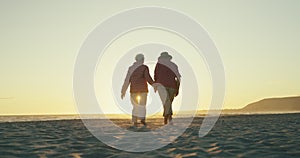 Sunset beach walk, senior couple and holding hands in nature with love, support or adventure together. Sunrise, travel