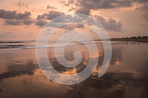 Sunset on the beaches of Pandagaran in Java, Indonesia photo