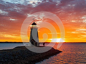 Sunset beautiful afterglow over the lighthouse of Lake Hefner