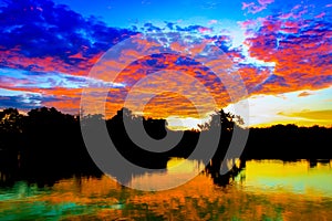 Sunset beautiful colorful landscape and silhouette tree reflex water river in sky twilight time with copy space add text