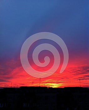 Sunset with beautiful colors of sky and clouds, sunrays