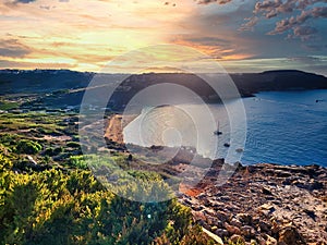 Sunset from the beautiful coral.  Seascape during sundown. The sea at height tide. Gold backgrounds textures.  Dramatic cloudscape