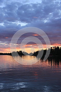 Sunset over the water, Lake of the Woods, Kenora, Ontario photo