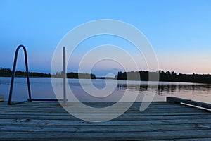 Evening on the dock, Lake of the Woods, Kenora, Ontario photo
