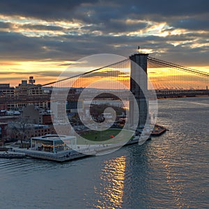 Sunset behind the Brooklyn Bridge in NYC