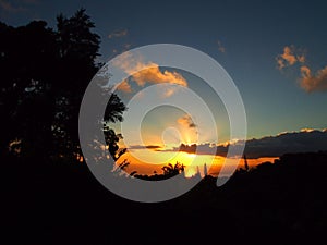 Sunset behind the clouds over the ocean on Tantalus mountain