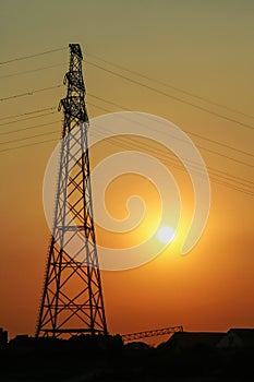 Sunset behind electricity pole - sunset landscape in town - city view