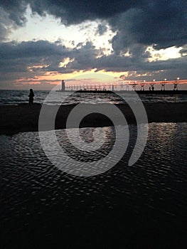Sunset behind Michigan pier
