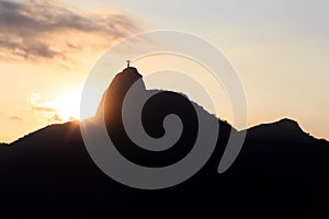 Sunset behind Mountain Corcovado Christ the Redeemer, Rio de Ja