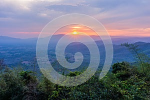 Sunset behind mountain at Pha Kep Tawan viewpoint.