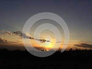 Sunset behind Niihau Island - View from Waimea Canyon on Kauai Island, Hawaii.