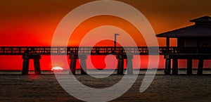 Sunset behind the pier of Fort Myers Beach, Florida