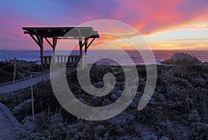 Sunset behind a public gazebo at Asilomar State Beach in California photo