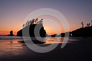 Sunset behind sea stacks