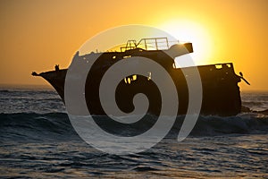 Sunset behind shipwreck near cape agulhas