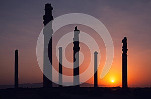 Sunset behind Silhouette of Apadana Palace Ruins in Persepolis Archeological Site of Shiraz