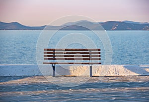 sunset and bench in Rafina city with Aegean sea at the background