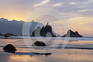 Sunset at Benijo beach or Playa de Benijo featuring majestic volcanic rocks emerging from the ocean