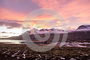 The sunset in Berufjordur fjord in east icelandic countryside photo