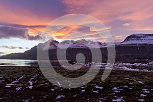 The sunset in Berufjordur fjord in east icelandic countryside photo