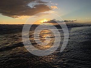 Sunset at Black Sand Beach in Kekaha in Winter on Kauai Island Hawaii.