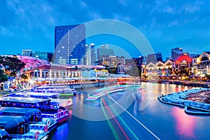 Sunset Blue Hour at Clarke Quay on Singapore River With Boat Light Trails