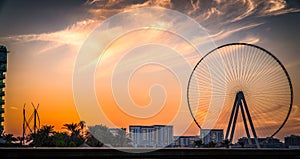 Sunset on Bluewaters Island, with the famous Ain Dubai Ferris wheel, with shot point from Marina Beach Perfect shot for travel,