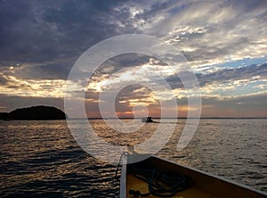 Sunset from the boat approaching Abad Santos Island in Hundreed Islands National Park, Alaminos, Philippinnes