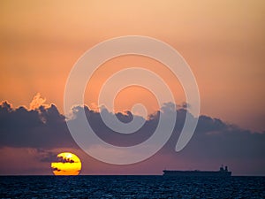 Sunset and boat Curacao Views