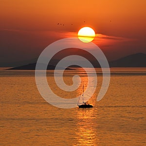 Sunset with a boat photo