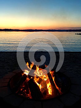 Sunset bonfire on the beach at Chippewa Lake, Michigan.